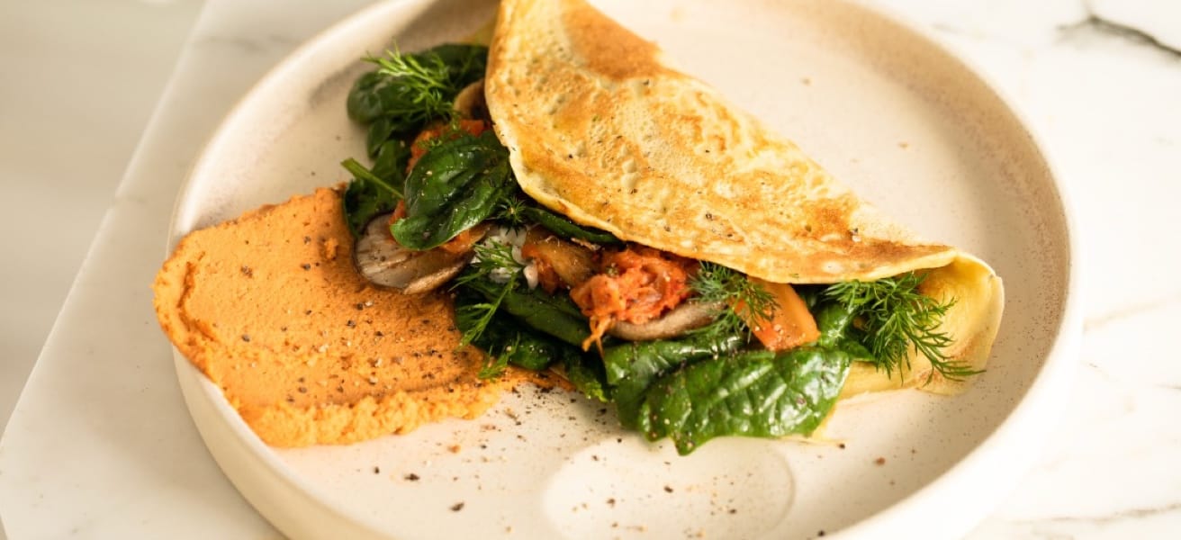 picture of a delicious omelette with spinach and vegetables